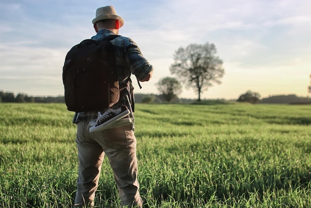 Man with backpack trip nature