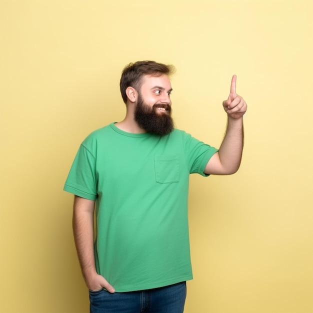 Photo man with a beard and green shirt pointing with the index finger