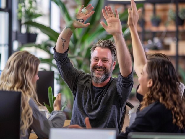 Photo a man with a beard is clapping with other people in the background