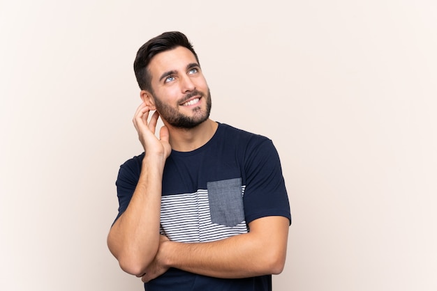 Man with beard over wall