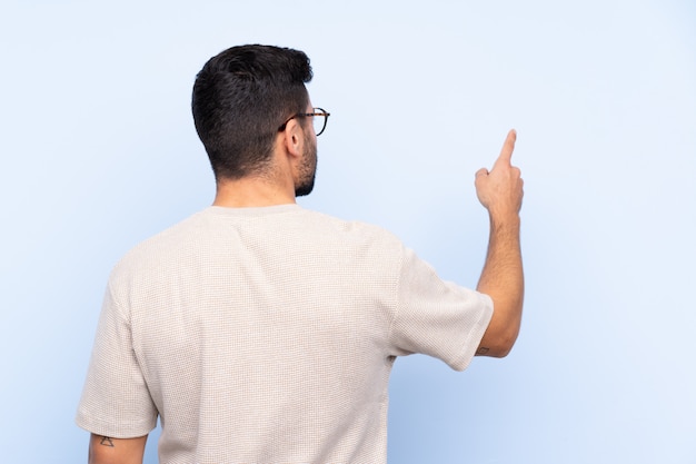 Man with beard over wall