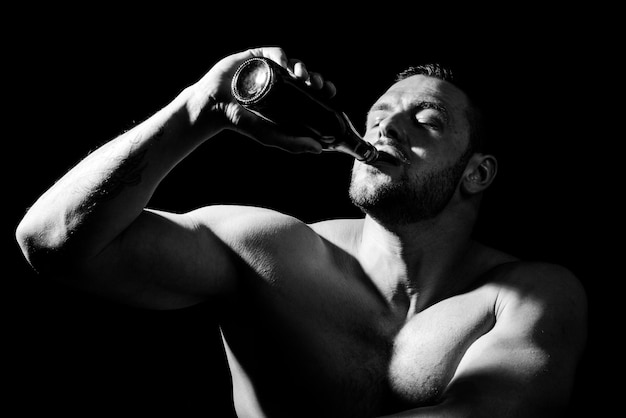 Man with bottle of beer close up face drunk guy having problem from alcohol addiction abuse alcoholi...