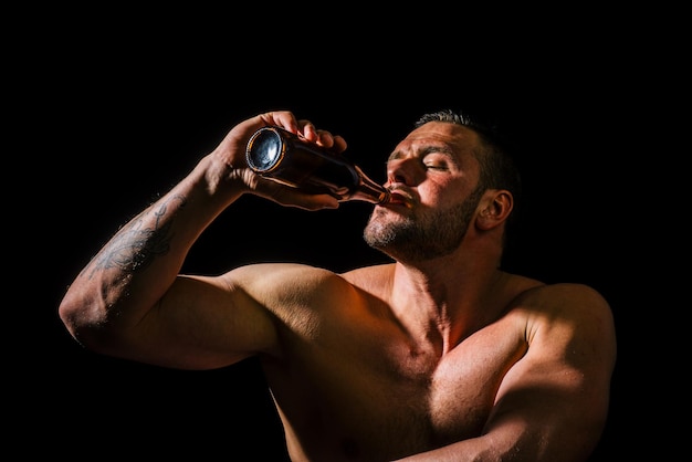 Man with bottle of beer close up face drunk man drinker alcoholic with alcoholism problem alcohol ab...