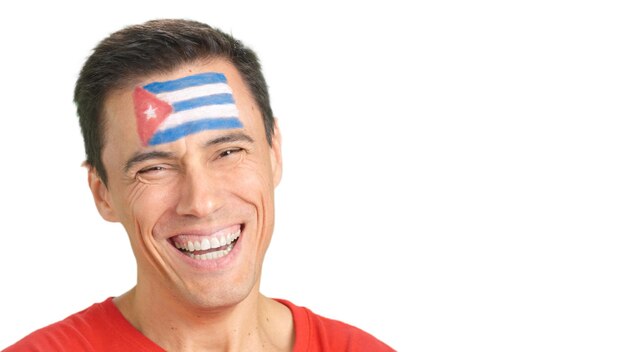 Man with a cuban flag painted on the face smiling