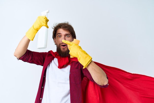 Man with detergent in hands in rubber gloves professional housework cleaning