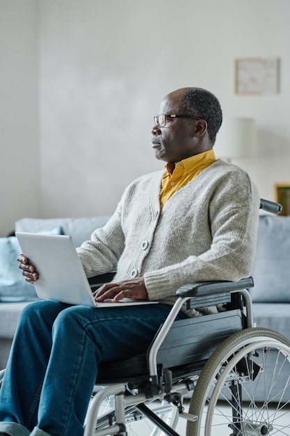 Man with disability working on laptop