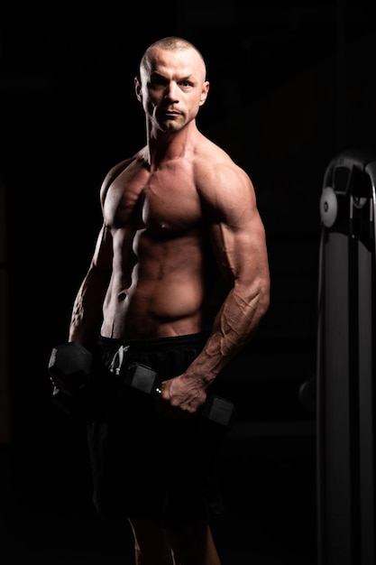 Man With Dumbbells Exercising Biceps