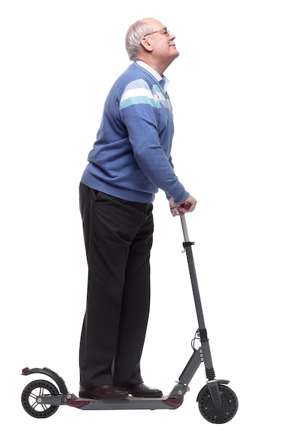 Man with an electric scooter reading an ad on a white screen