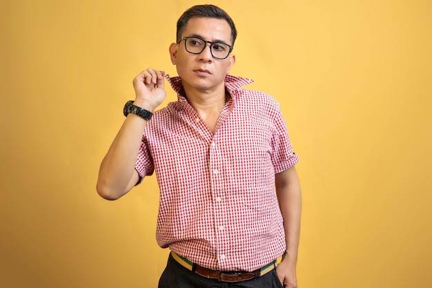 Man with eyeglasses and a shirt standing