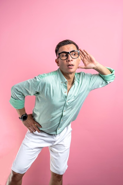 Man with eyeglasses and a shirt standing