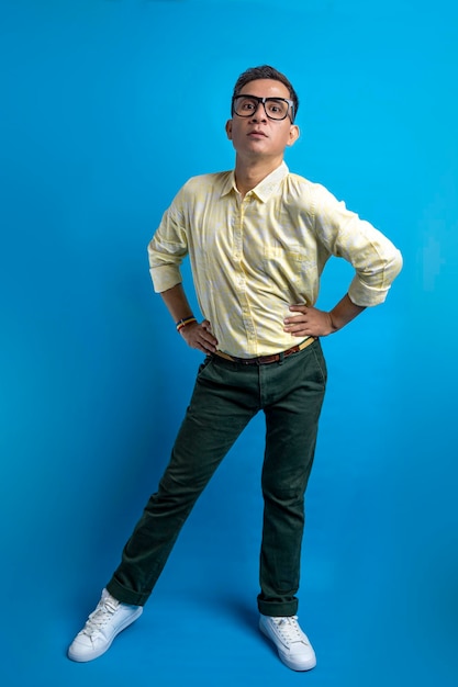 Man with eyeglasses and a shirt wearing a rainbow bracelet