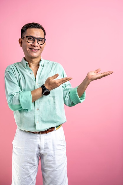 Man with eyeglasses and a shirt with open palm hand showing something