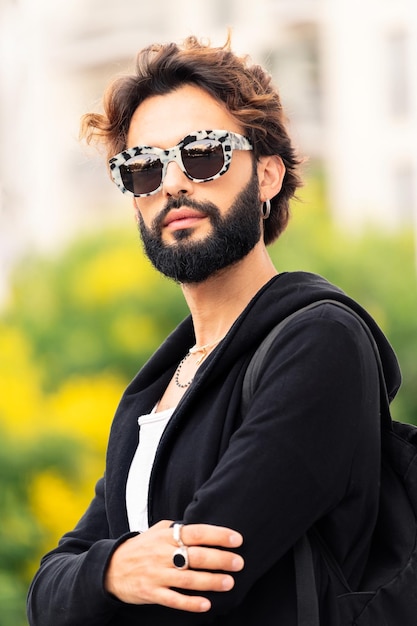 Man with fashionable sunglasses looking at camera