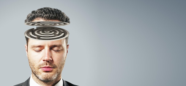 A man with a giant oil drum on his head