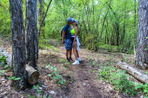 A man with a girl in the forest near the cave town of TepeKermen Crimea Russia 2021