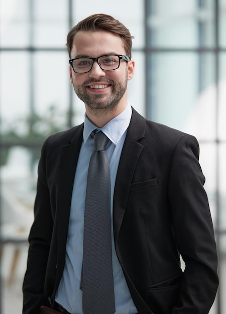 A man with glasses feels confident in the office