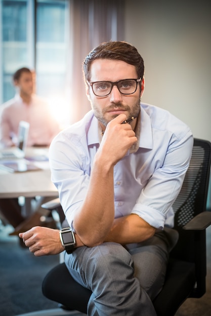 Man with hand on chin