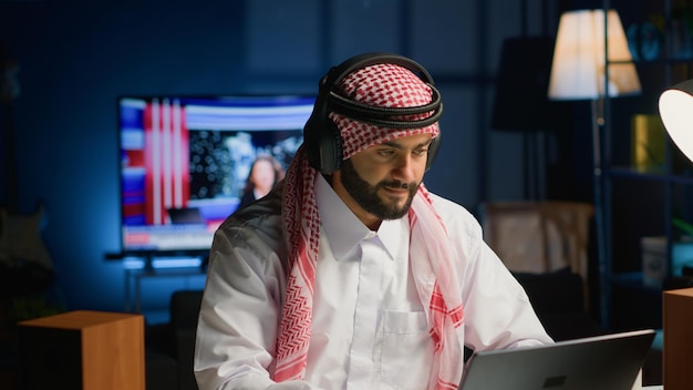 Man with headphones in home office