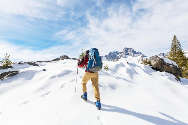 Man with hiking equipment walking in Sierra Nevada mountains, California, USA