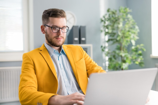 Man with laptop in office