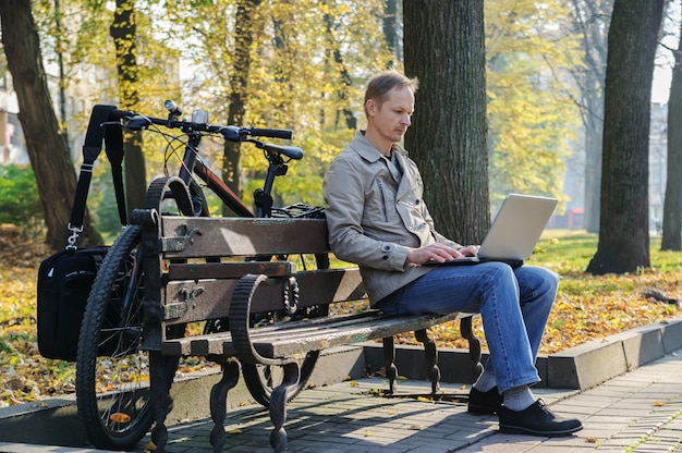 The man with a laptop.