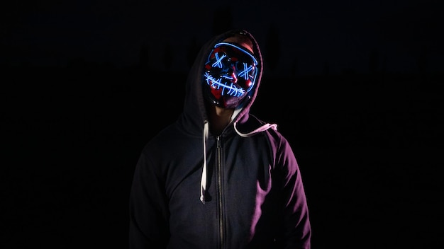 Man with lights purge mask with black background