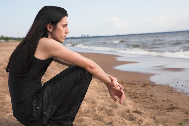 Man with long hair on the beach