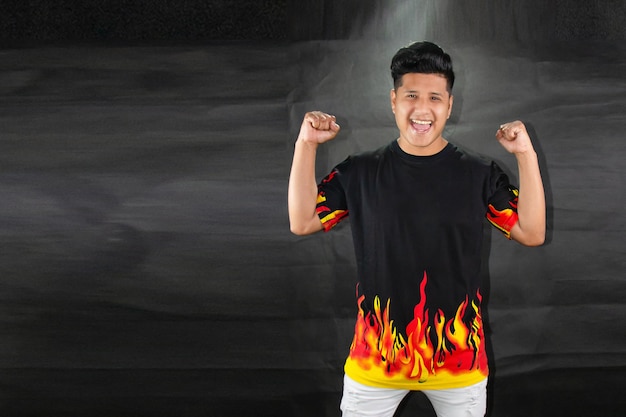 Man with polo shirt with flames and gesture of feeling and emotions. Advertising offer concept