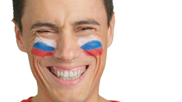 Man with a russian flag painted on the face smiling