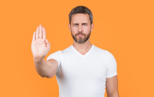 Man with stop and no gesture in studio photo of stop man show no man with no stop gesture