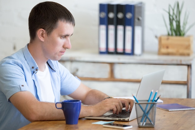 Man with tired face on a laptop