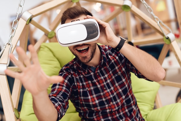 A man with virtual reality glasses.