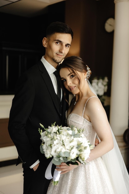 a man and a woman are posing for a photo