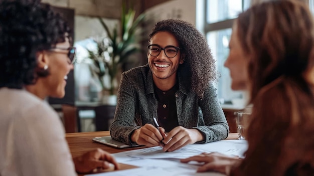 Photo a man and woman are sitting at a table with papers and a woman in a suit and a man with glasses looking at them