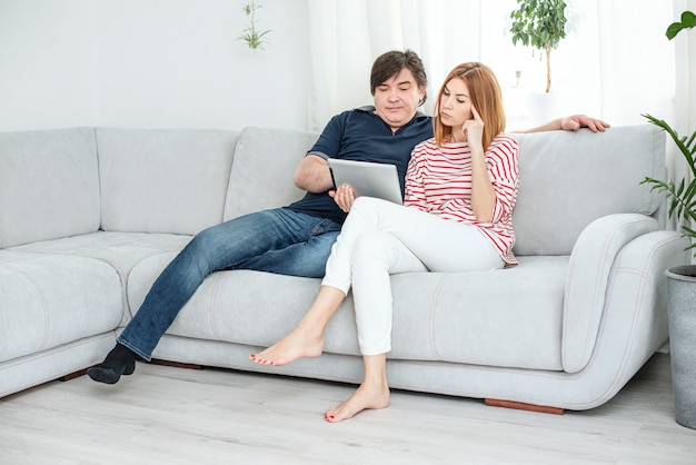 Man and woman communicate by video link