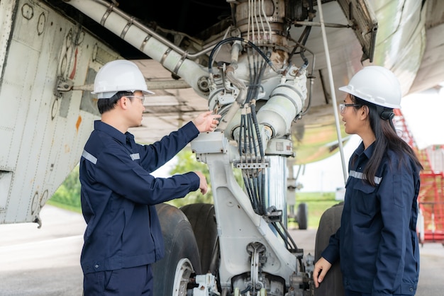 man and woman engineer maintenance airplane