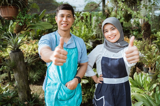 Man woman gardener thumb up