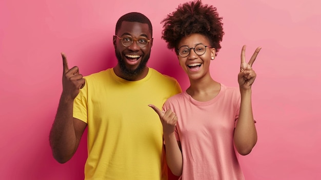 a man and a woman pose for a picture with their hands up