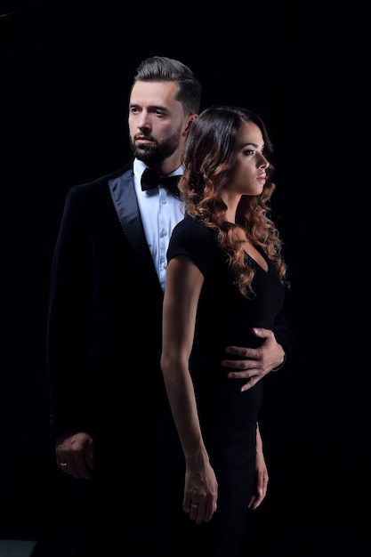 Man next to woman posing in studio