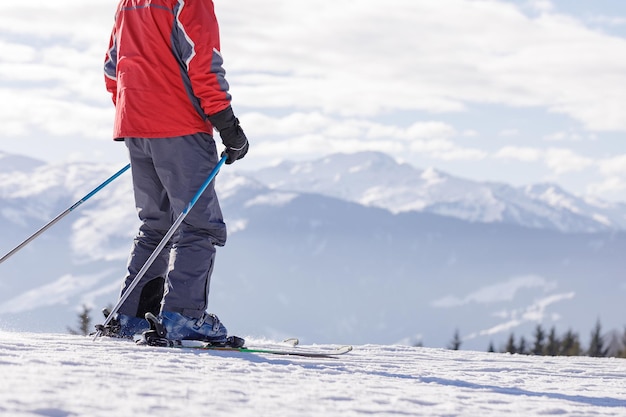 Man and woman skiing and snowboarding in the mountains ski resort