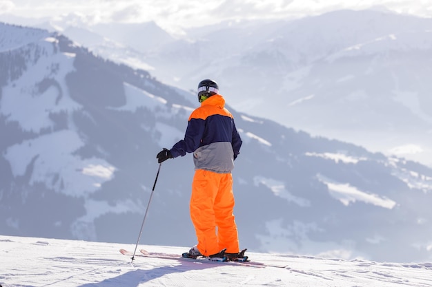 Man and woman skiing and snowboarding in the mountains ski resort