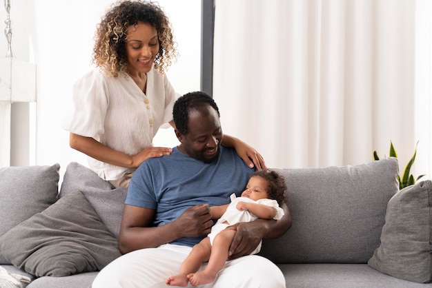 Man and woman taking care of their baby girl