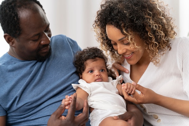 Man and woman taking care of their baby girl