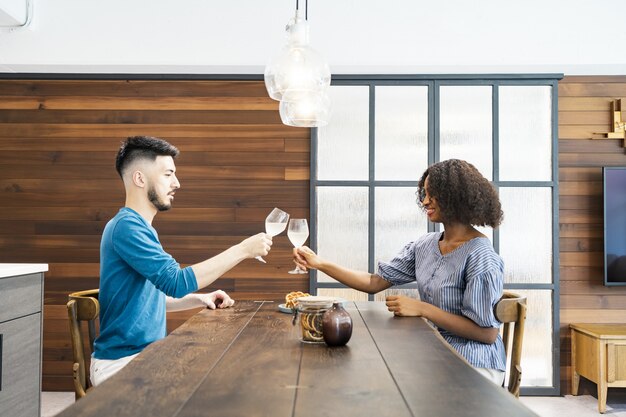 Man and woman talking with wine