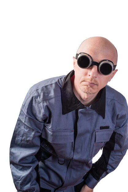 A man in working clothes in dark gaswelding glasses