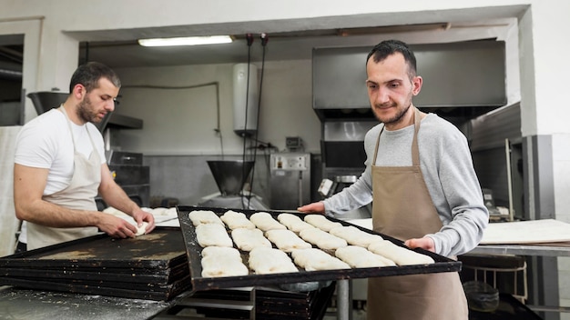 Man working on delicious fresh breads