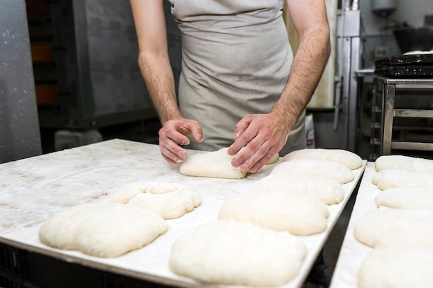 Man working on delicious fresh breads