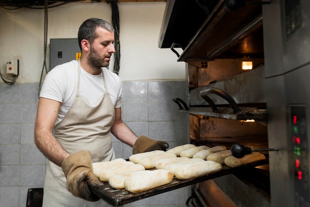 Man working on delicious fresh breads