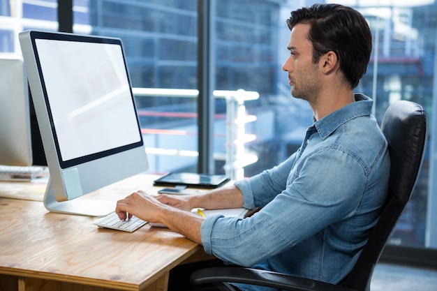 Man working on desktop pc