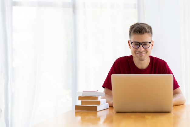 Man working from home in modern white room